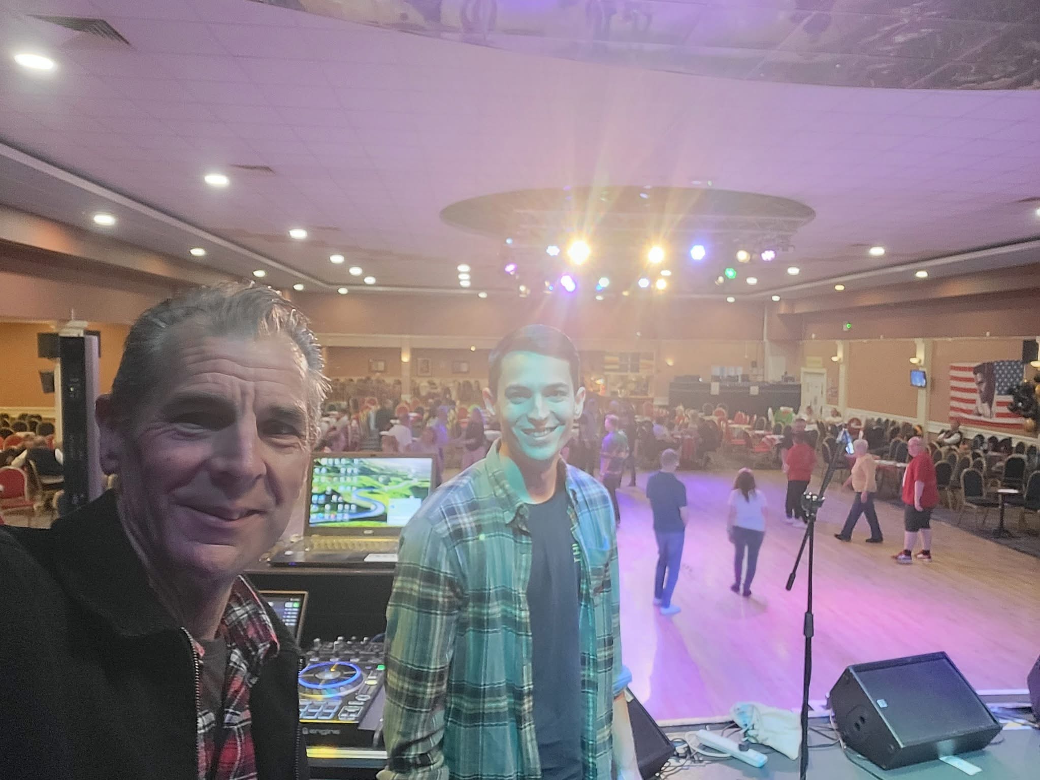 DJ and performer at a crowded dance event