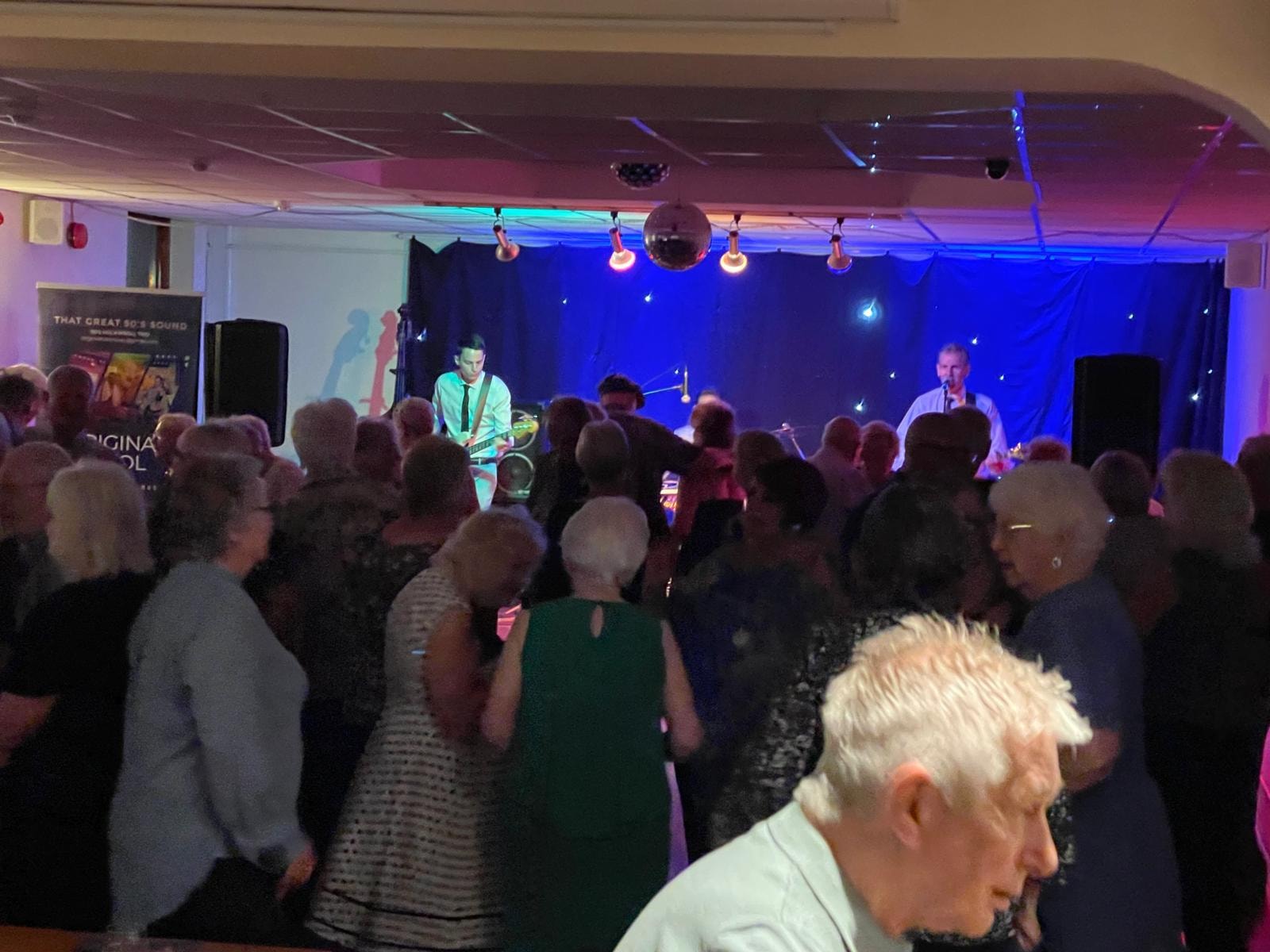 Packed dancefloor — Original Cool banner visible on stage